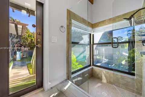 6140 Southwest 56th Court Davie, FL 33314 - Photo 27 of 69 Glass shower sanctuary with tropical garden backdrop!
