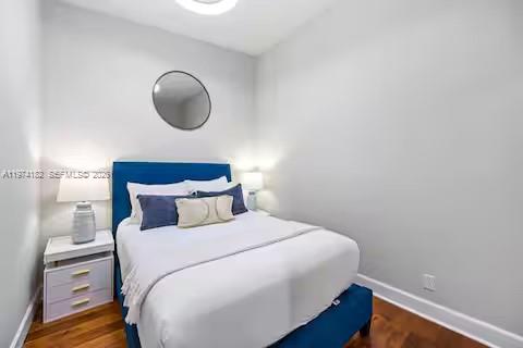 6140 Southwest 56th Court Davie, FL 33314 - Photo 29 of 69 Cozy bedroom with bold blue accent wall!