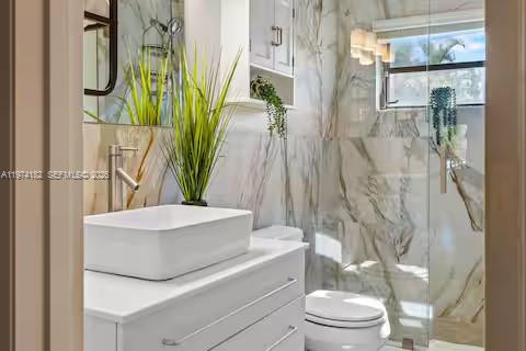6140 Southwest 56th Court Davie, FL 33314 - Photo 31 of 69 Marble bathroom paradise with vessel sink glamour!