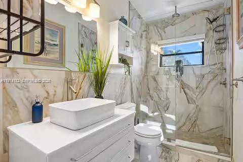 6140 Southwest 56th Court Davie, FL 33314 - Photo 32 of 69 Spa-like bathroom with dramatic marble walls!