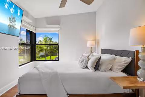 6140 Southwest 56th Court Davie, FL 33314 - Photo 33 of 69 Bedroom with big screen TV and palm tree views!