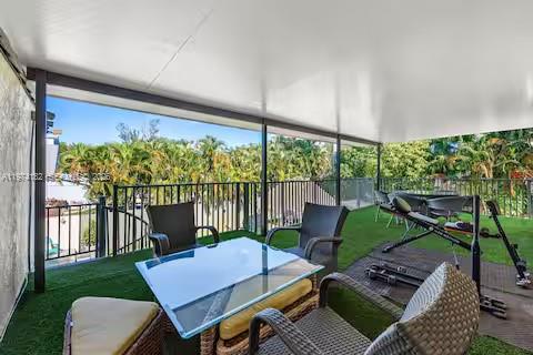 6140 Southwest 56th Court Davie, FL 33314 - Photo 36 of 69 Covered balcony dining with lush jungle views!