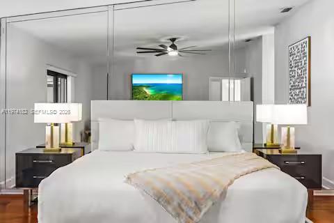 6140 Southwest 56th Court Davie, FL 33314 - Photo 40 of 69 Mirror-backed headboard creates bedroom drama and space!