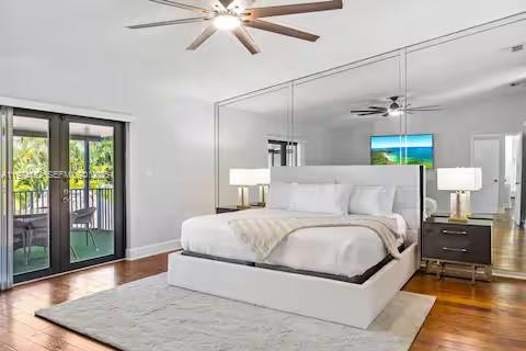 6140 Southwest 56th Court Davie, FL 33314 - Photo 42 of 69 Spacious bedroom with mirrored closets and hardwood floors!