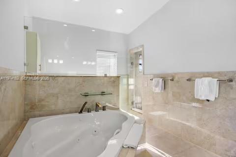 6140 Southwest 56th Court Davie, FL 33314 - Photo 45 of 69 Luxe bathroom with jetted tub and travertine elegance!