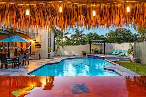 6140 Southwest 56th Court Davie, FL 33314 - Photo 54 of 69 Resort-style pool with thatched cabana lighting!