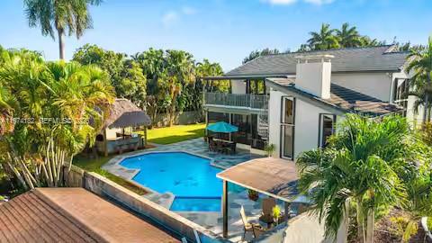 6140 Southwest 56th Court Davie, FL 33314 - Photo 59 of 69 Aerial view of backyard oasis with pool and tiki hut!