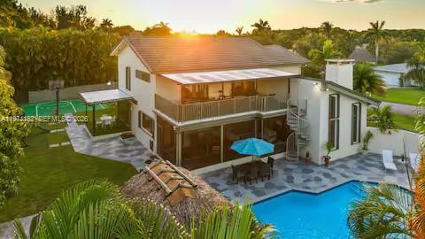 6140 Southwest 56th Court Davie, FL 33314 - Photo 67 of 69 Sunset drone view of modern tropical estate!