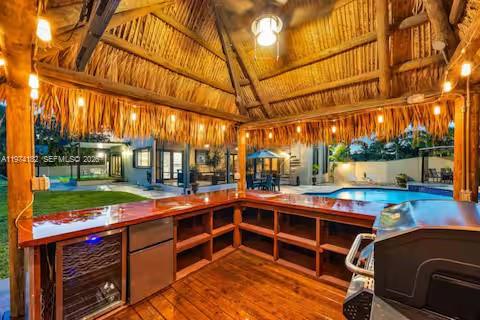 6140 Southwest 56th Court Davie, FL 33314 - Photo 9 of 69 This tiki bar’s so chill, even the grill’s on island time!