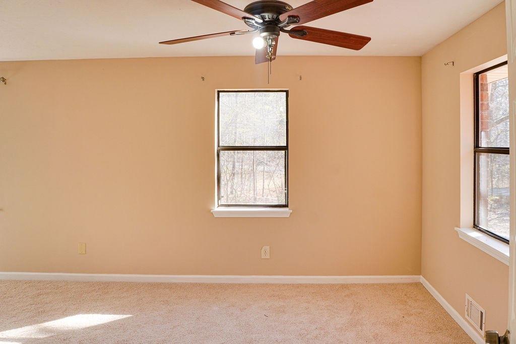 220 Winding Stream Trail Hampton, GA 30228 - Photo 17 of 35 an empty room with windows and fan