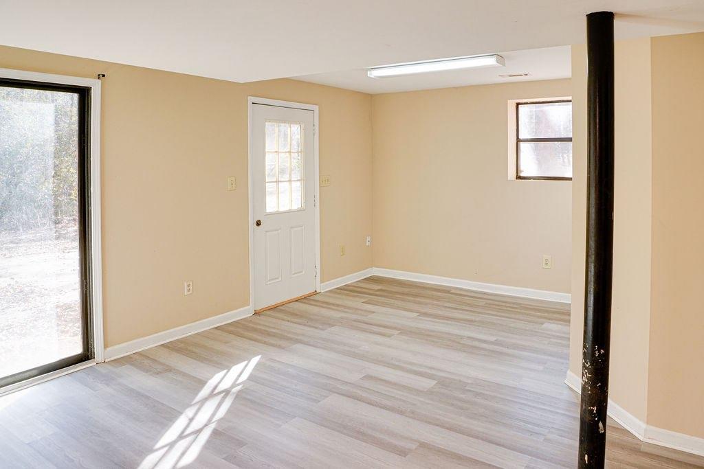 220 Winding Stream Trail Hampton, GA 30228 - Photo 21 of 35 a view of empty room with wooden floor and fan