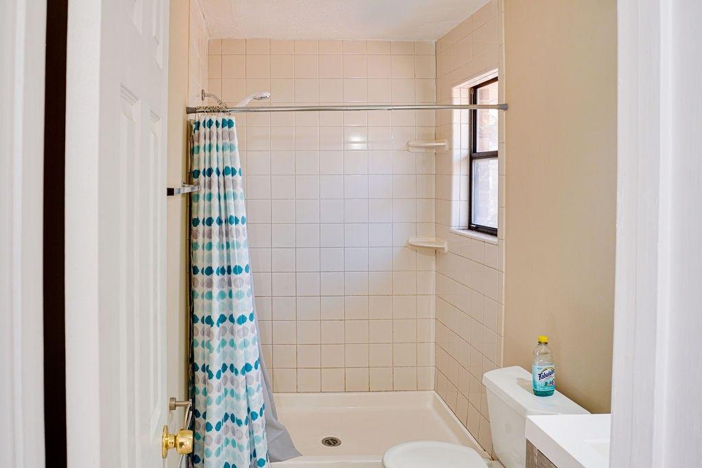 220 Winding Stream Trail Hampton, GA 30228 - Photo 26 of 35 a bathroom with a shower and a toilet