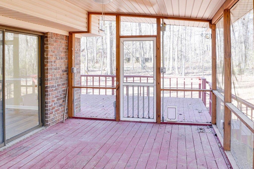 220 Winding Stream Trail Hampton, GA 30228 - Photo 29 of 35 a view of a room with wooden floor and floor to ceiling window
