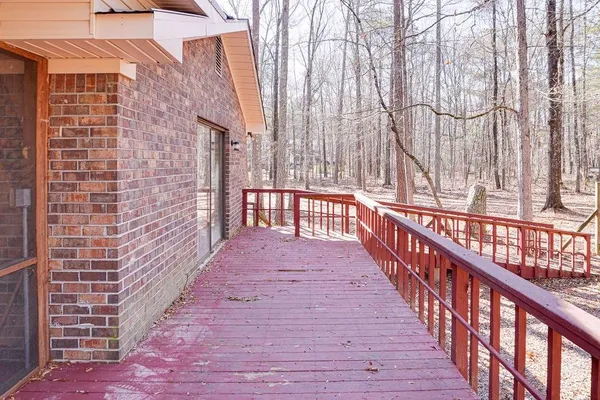 a view of a balcony with wooden floor