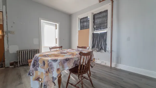 a bedroom with a bed and a table