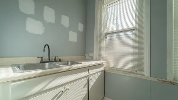 a bathroom with a toilet sink and shower