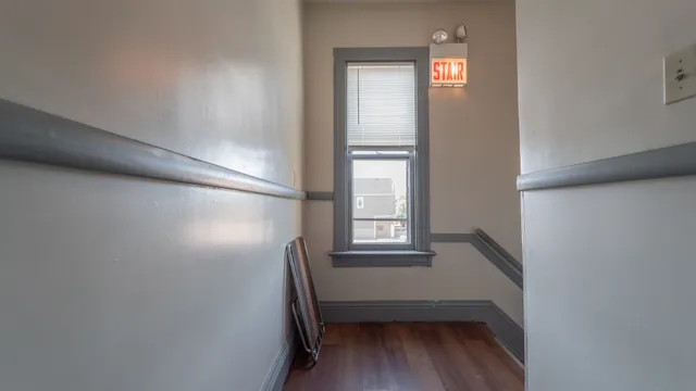 a utility room with granite countertop cabinets washer and dryer