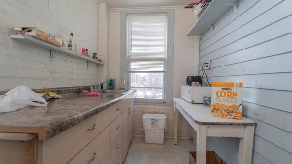 a room with a window and a walk in closet