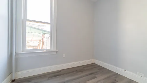 a bathroom with a sink mirror and toilet