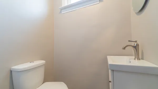 a street sign on a brick wall