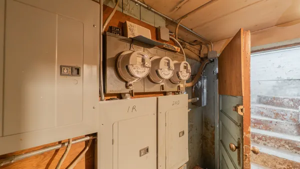 a bathroom with a glass door shower and a sink