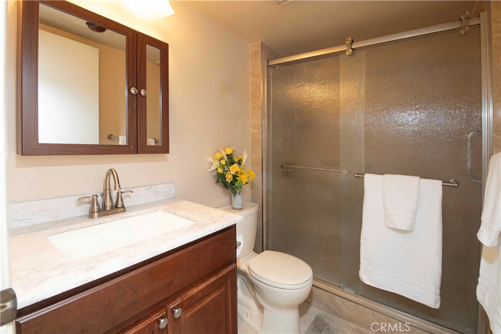 6545 Reseda Boulevard, Unit 8 Reseda, CA 91335 - Photo 14 of 24 a bathroom with a sink a toilet and shower