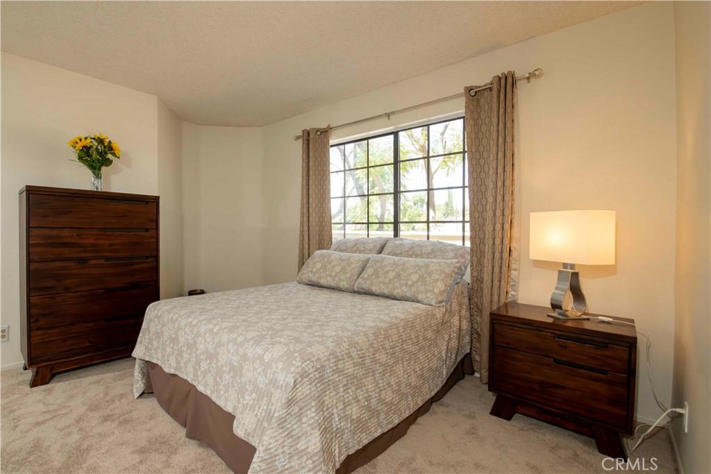 6545 Reseda Boulevard, Unit 8 Reseda, CA 91335 - Photo 18 of 24 a bedroom with a bed and a window