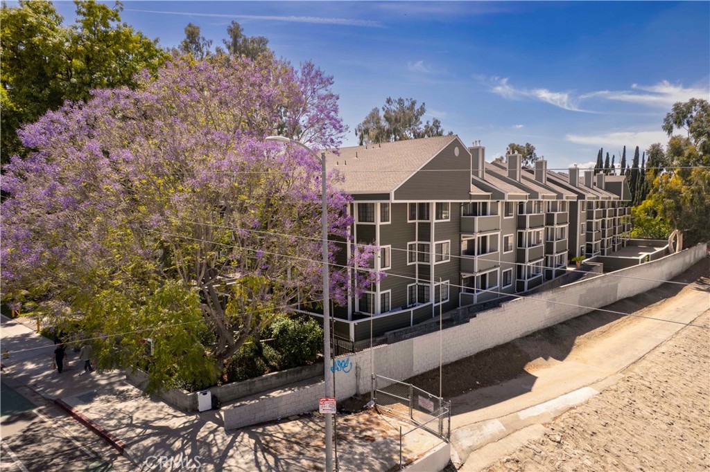 6545 Reseda Boulevard, Unit 8 Reseda, CA 91335 - Photo 3 of 24 a view of a house with a balcony