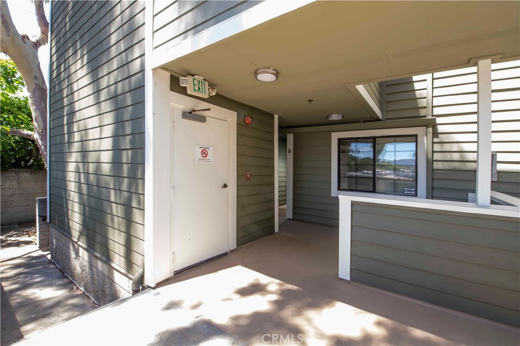 6545 Reseda Boulevard, Unit 8 Reseda, CA 91335 - Photo 5 of 24 a view of a house with a door and wooden walls