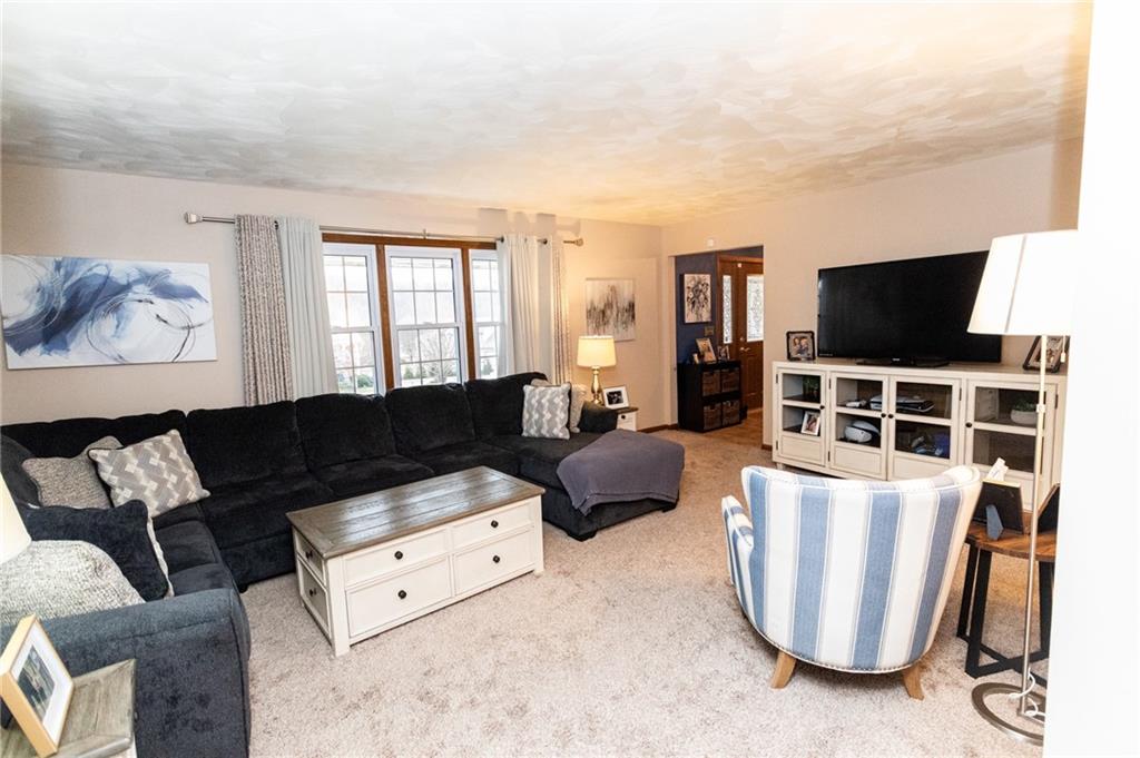 57 Russ Street Uniontown, PA 15401 - Photo 12 of 40 a living room with furniture and a flat screen tv