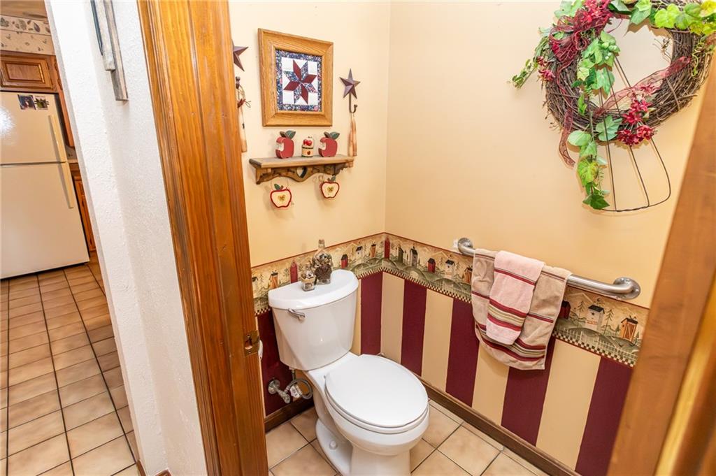 57 Russ Street Uniontown, PA 15401 - Photo 24 of 40 a white toilet sitting next to a sink