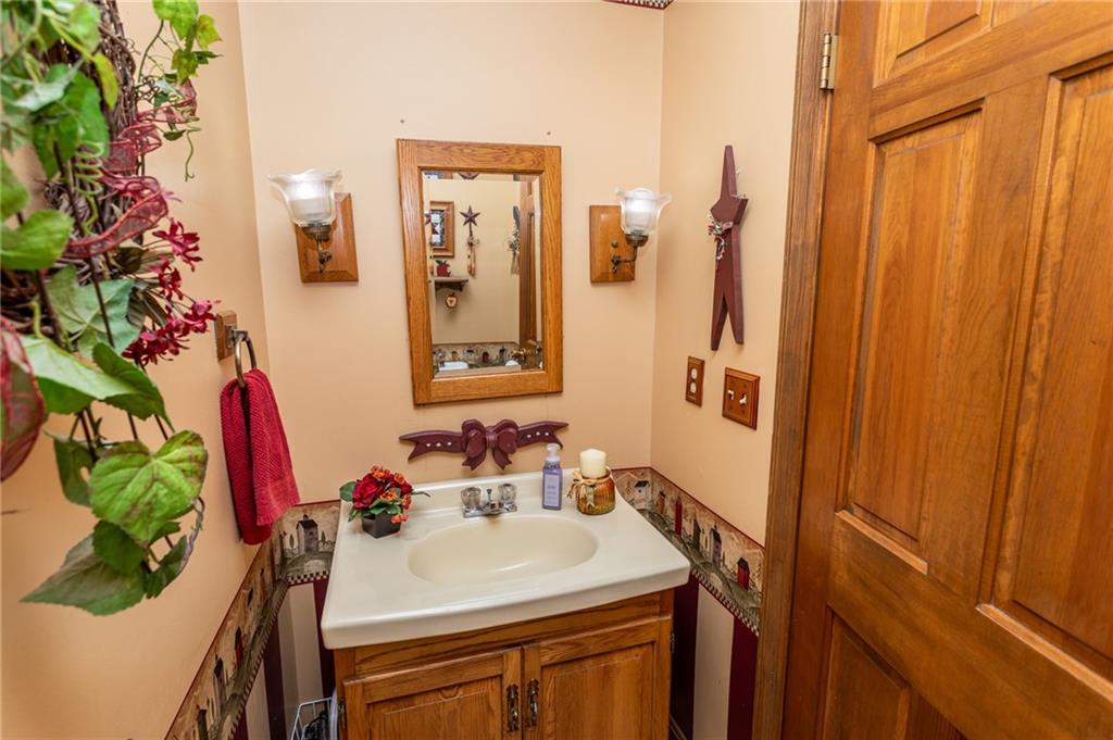 57 Russ Street Uniontown, PA 15401 - Photo 25 of 40 a bathroom with a sink vanity and a mirror