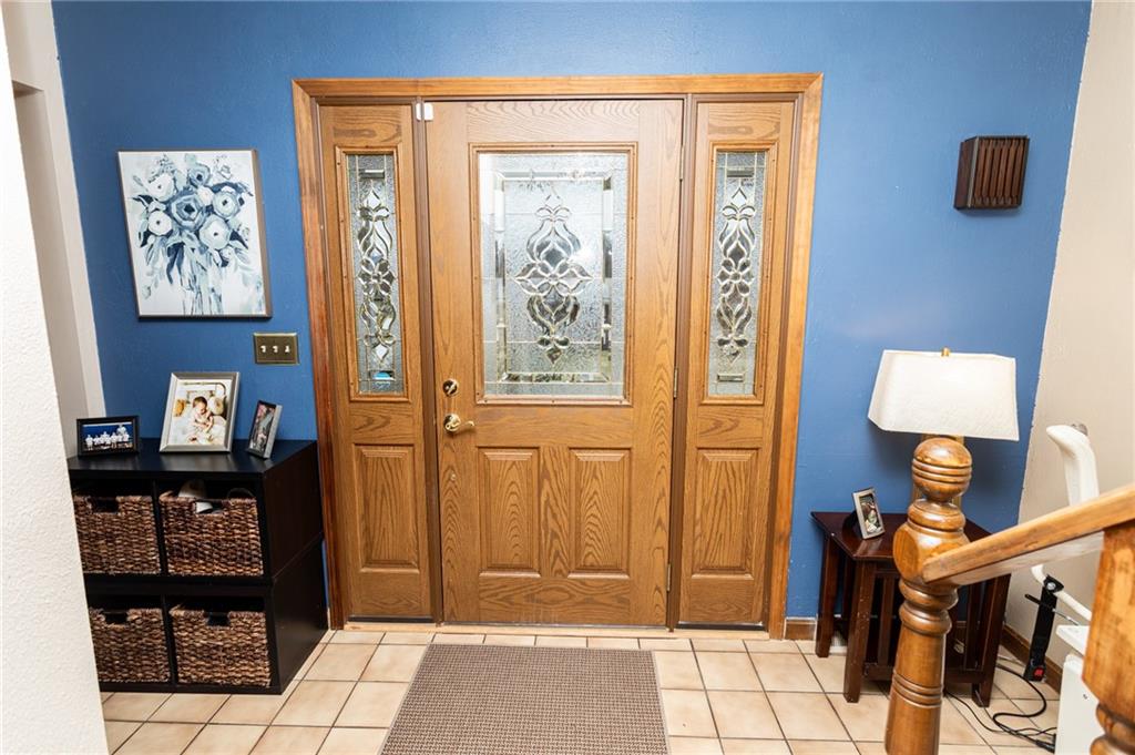 57 Russ Street Uniontown, PA 15401 - Photo 26 of 40 a view of a hallway with wooden floor and furniture