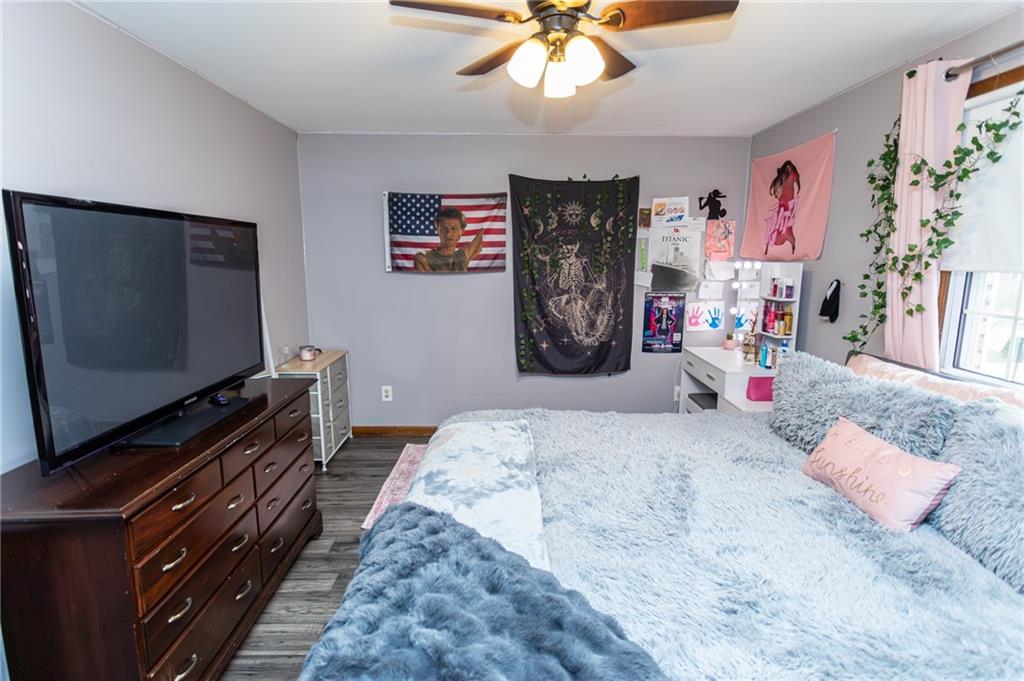 57 Russ Street Uniontown, PA 15401 - Photo 29 of 40 a bedroom with a bed and a flat screen tv