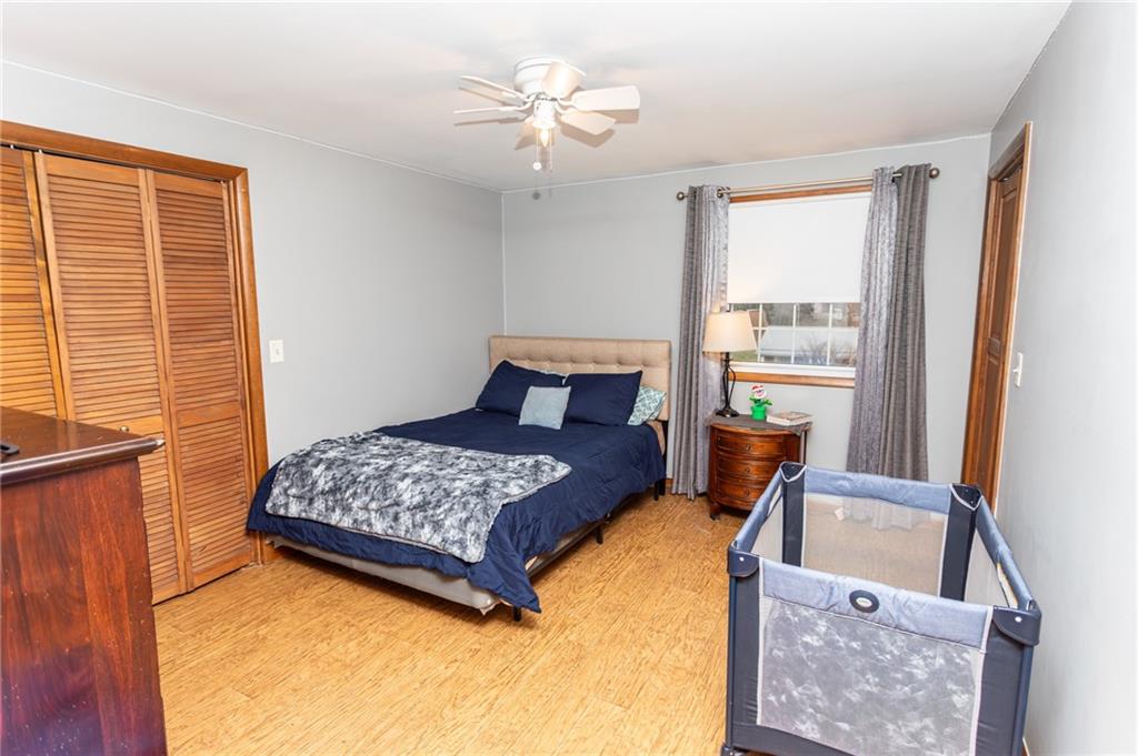 57 Russ Street Uniontown, PA 15401 - Photo 32 of 40 a bedroom with a bed dresser and a window