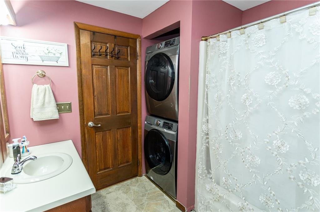 57 Russ Street Uniontown, PA 15401 - Photo 37 of 40 a bathroom with a sink a toilet and shower