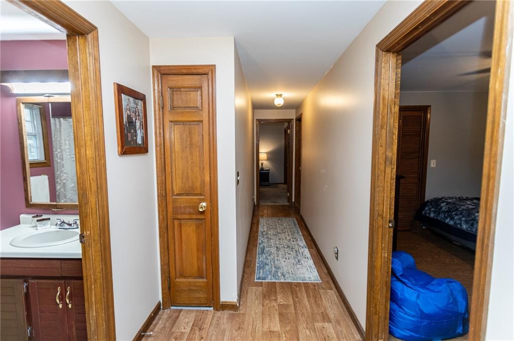 57 Russ Street Uniontown, PA 15401 - Photo 38 of 40 a view of a hallway with wooden floor and closet