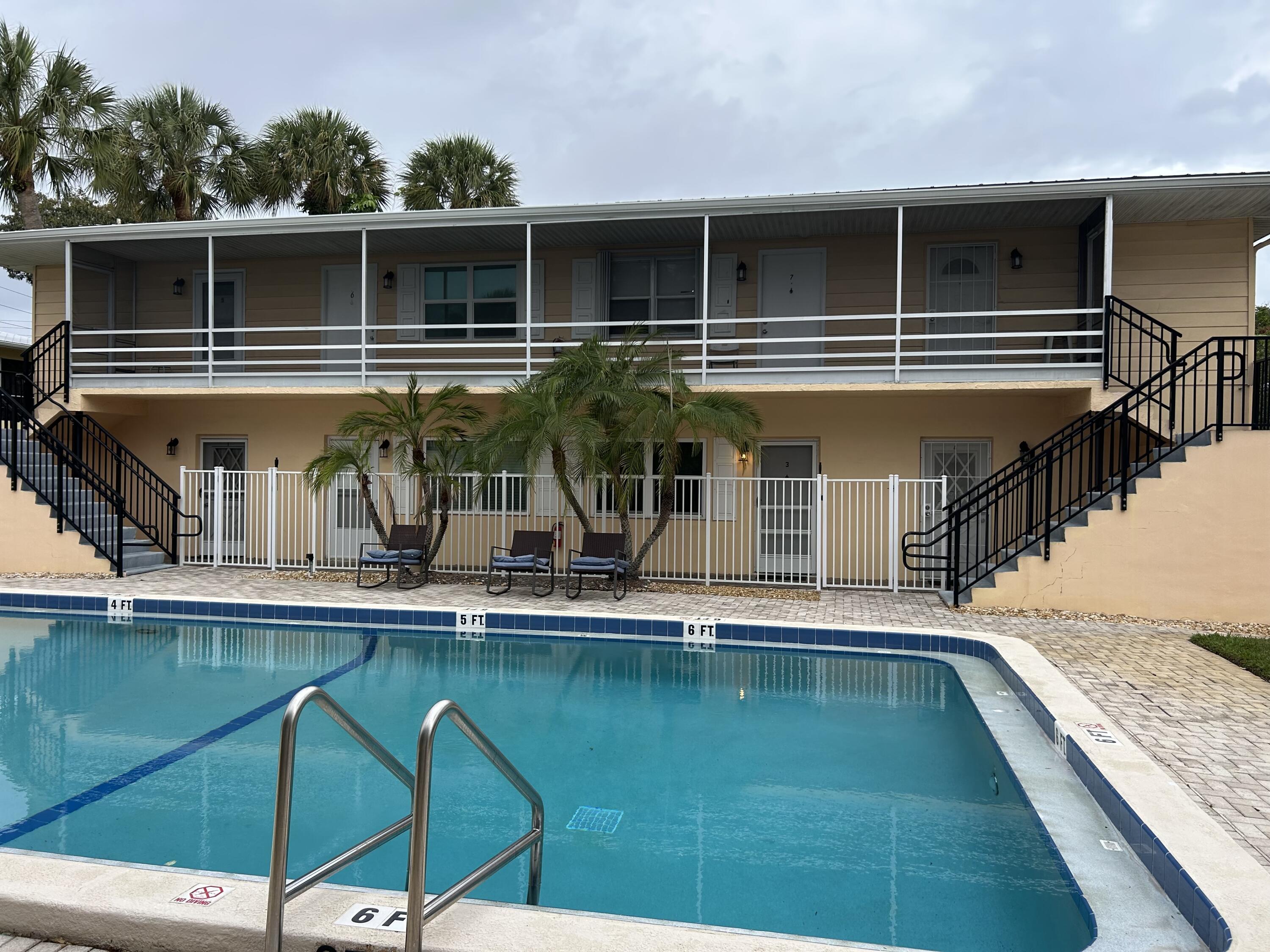 333 Southeast Martin Avenue, Unit 47 Stuart, FL 34996 - Photo 11 of 11 a view of house with swimming pool and furniture