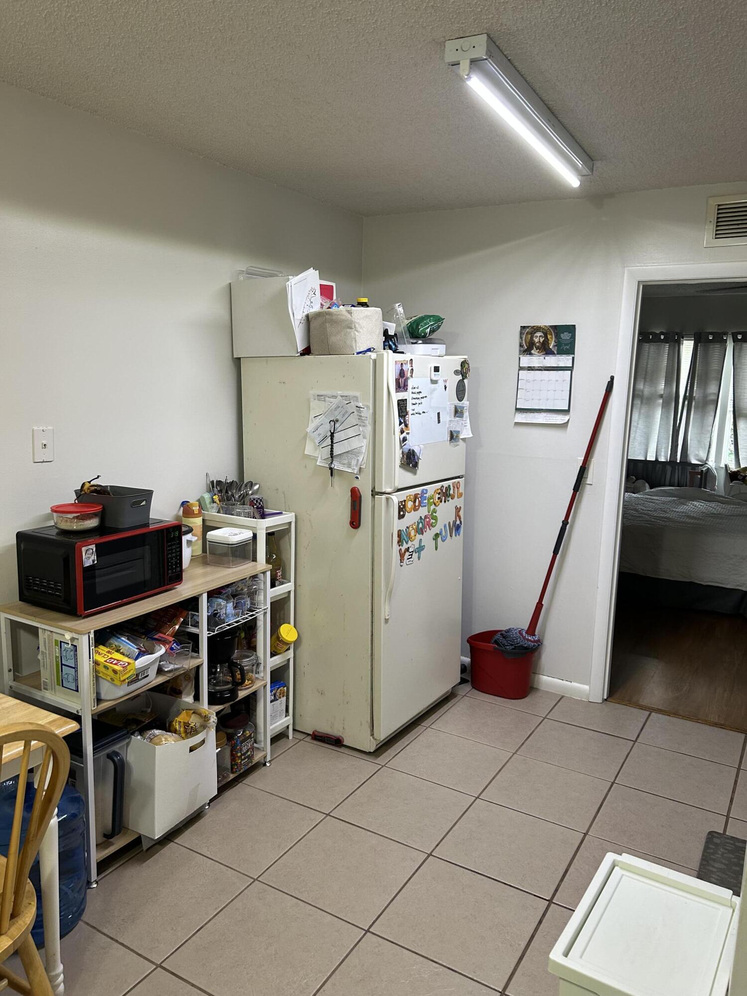 333 Southeast Martin Avenue, Unit 47 Stuart, FL 34996 - Photo 4 of 11 a room with storage and utility