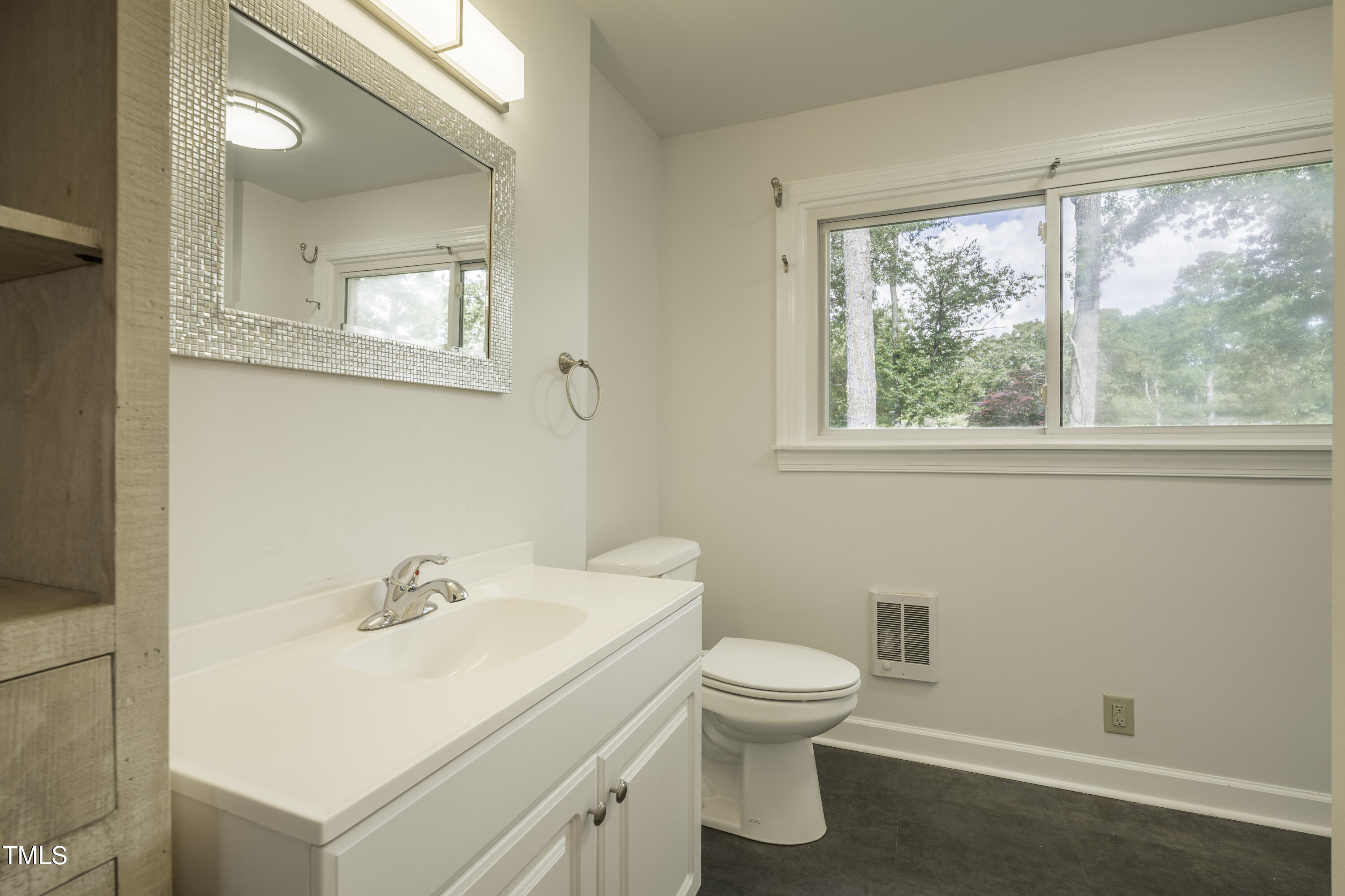 1604 Brunswick Drive Dunn, NC 28334 - Photo 28 of 43 a white toilet sitting next to a bathroom sink