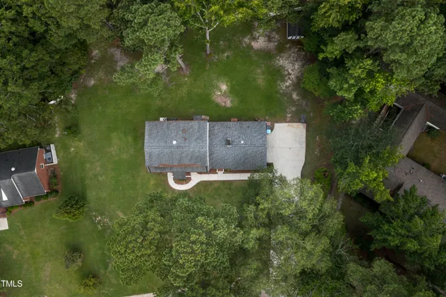 an aerial view of a house with outdoor space and street view