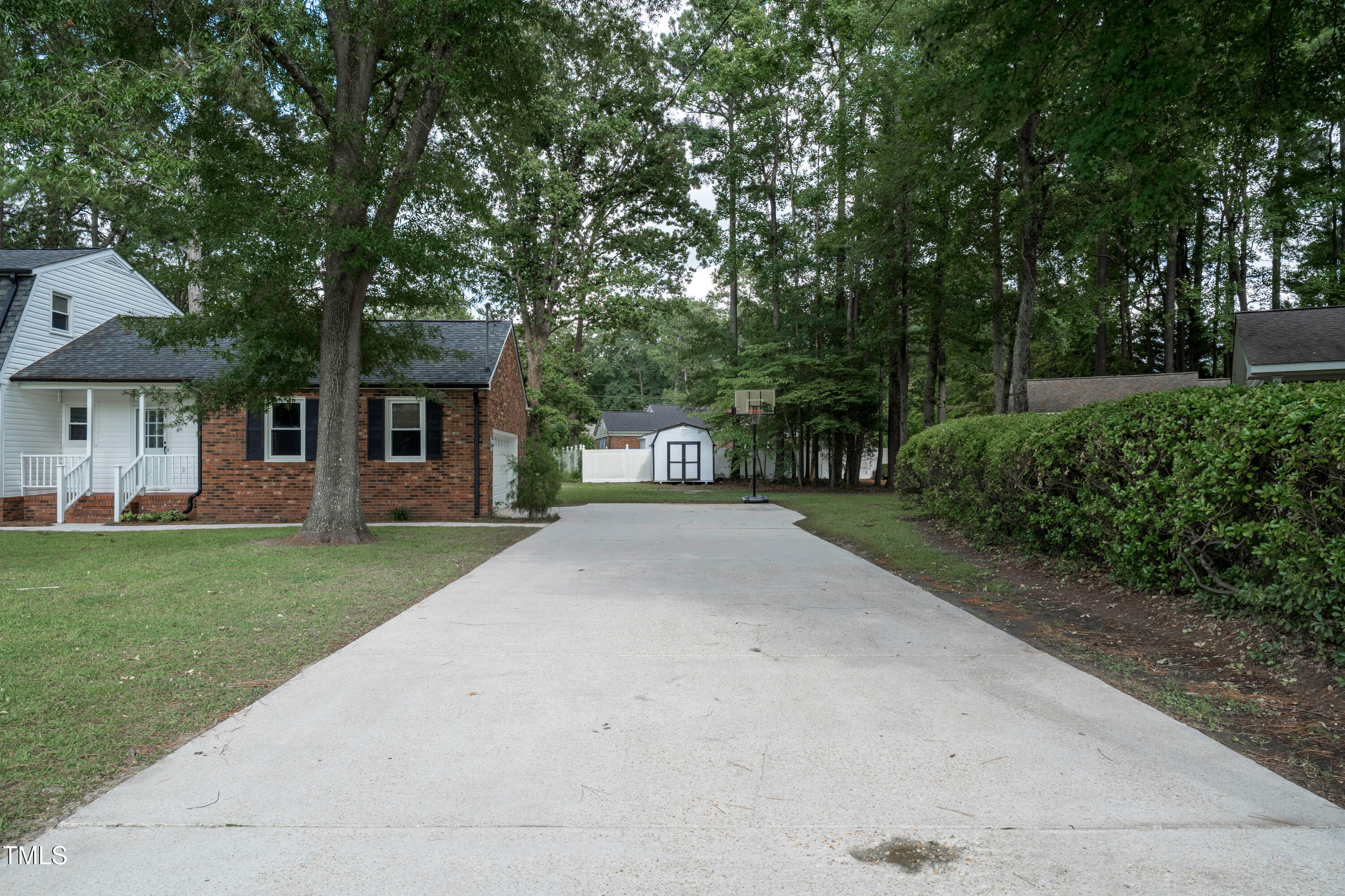 1604 Brunswick Drive Dunn, NC 28334 - Photo 6 of 43 a front view of a house with a yard and a garage