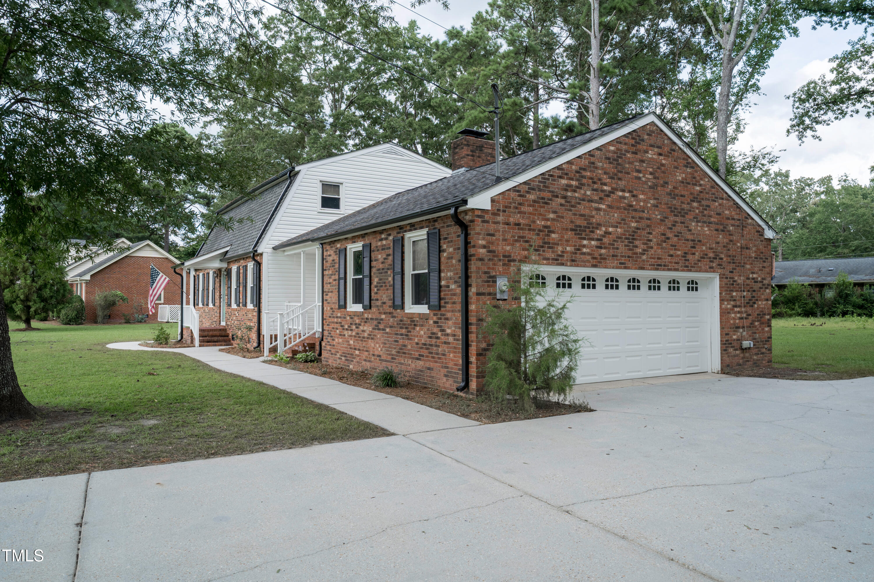 1604 Brunswick Drive Dunn, NC 28334 - Photo 7 of 43 a view of a house with a yard and large tree