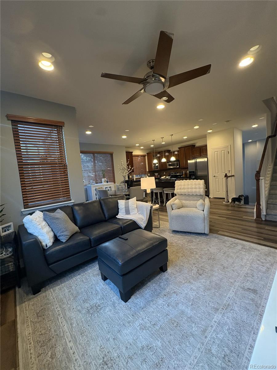 10158 RidgeGate Circle Lone Tree, CO 80124 - Photo 6 of 15 a living room with furniture and kitchen view