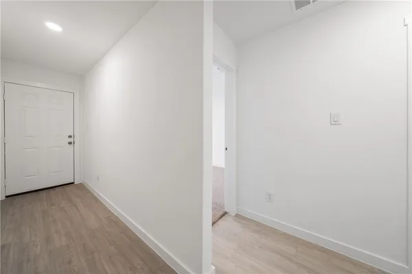 a view of small space with wooden floor