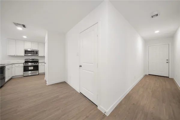 a view of kitchen with wooden floor