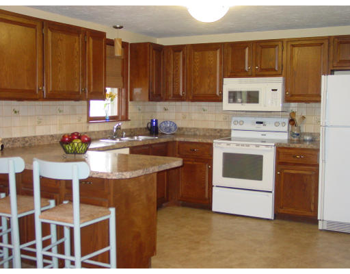 20 Pikes Hill Road Sterling, MA 01564 - Photo 5 of 16 a kitchen with stainless steel appliances granite countertop a stove a sink dishwasher and a refrigerator