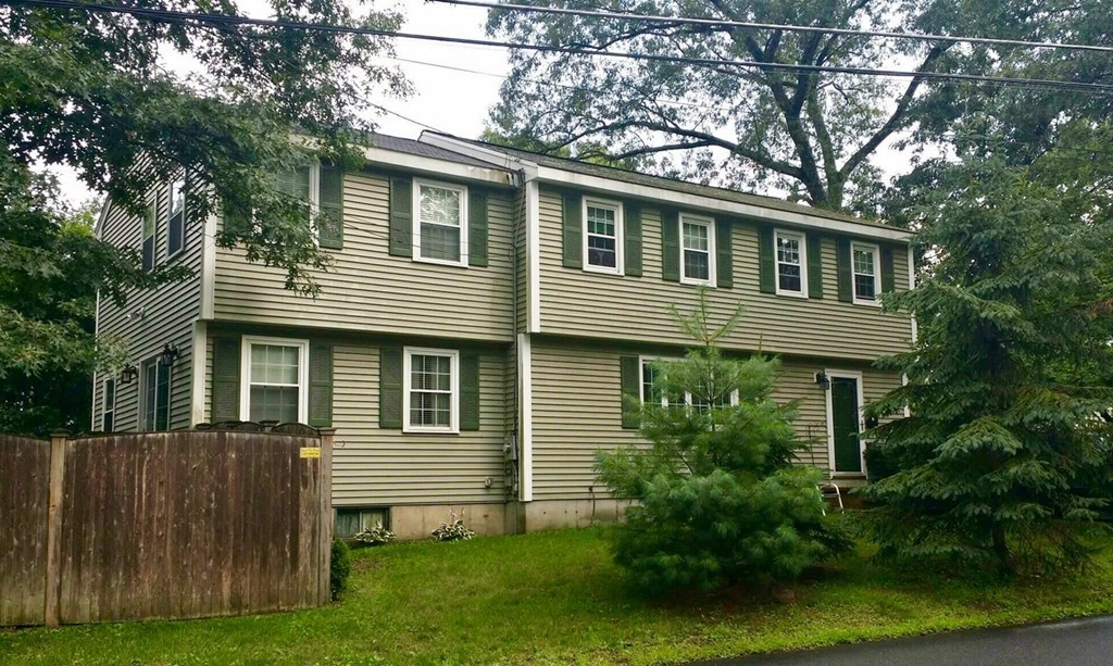 20 Patten Road Tewksbury, MA 01876 - Photo 1 of 29 a house that has a tree in front of a house