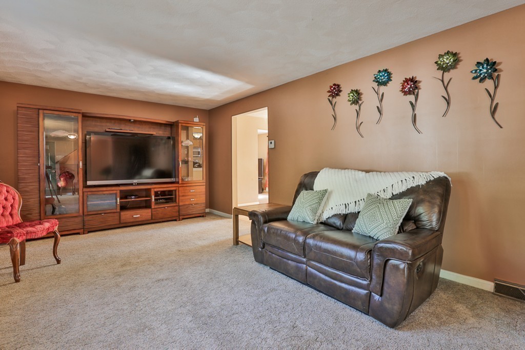 20 Patten Road Tewksbury, MA 01876 - Photo 13 of 29 a living room with furniture and a flat screen tv
