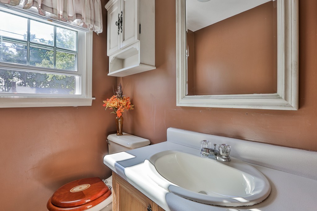 20 Patten Road Tewksbury, MA 01876 - Photo 15 of 29 a bathroom with a toilet a sink and mirror
